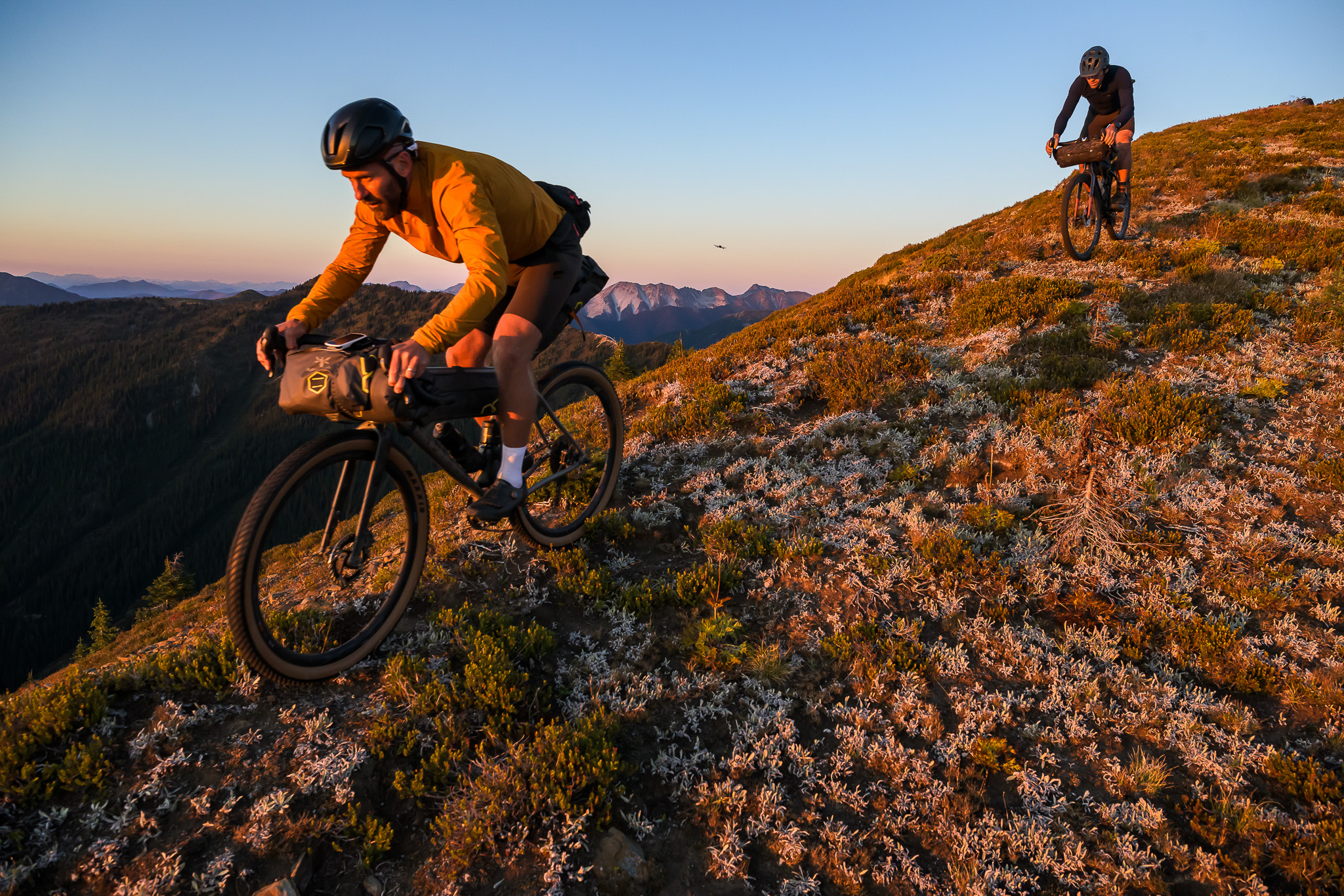 Svein Tuft riding his gravel bike at sunset. The Path Less Paved: Svein Tuft 