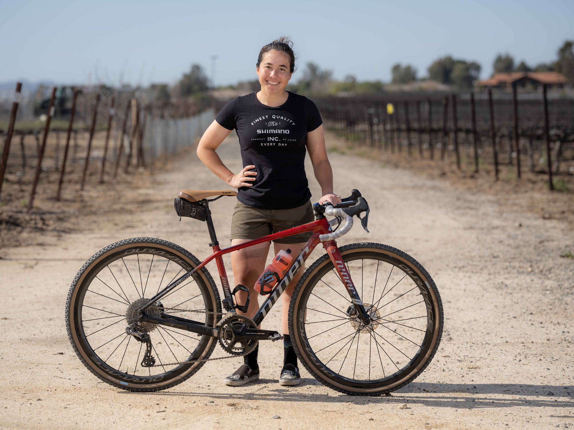 Amanda standing with her GRX bike