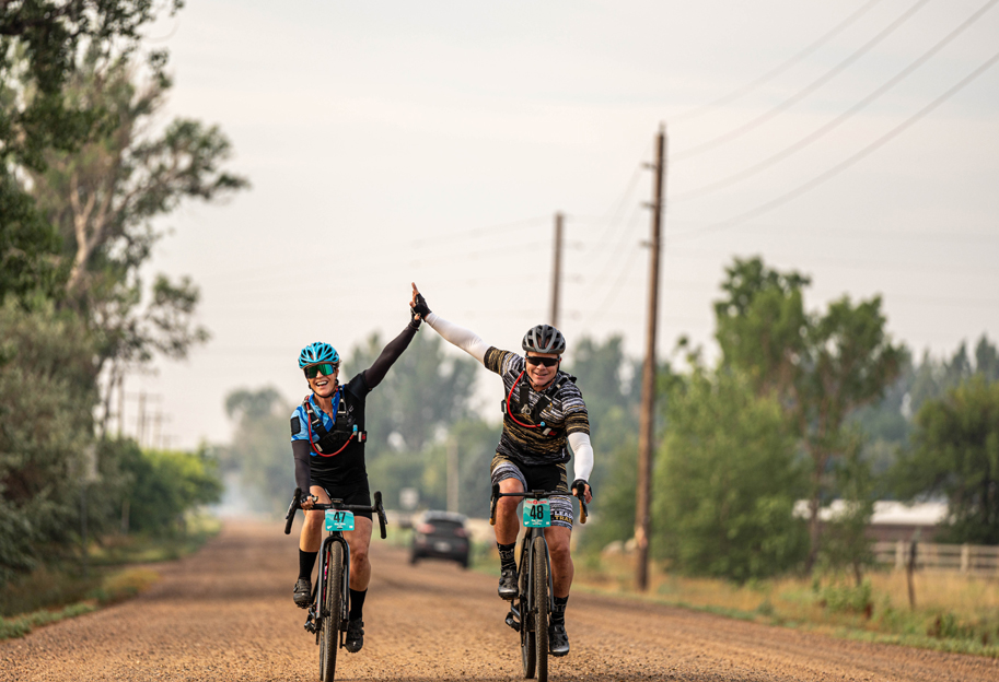 High-fives all around while riding gravel bikes